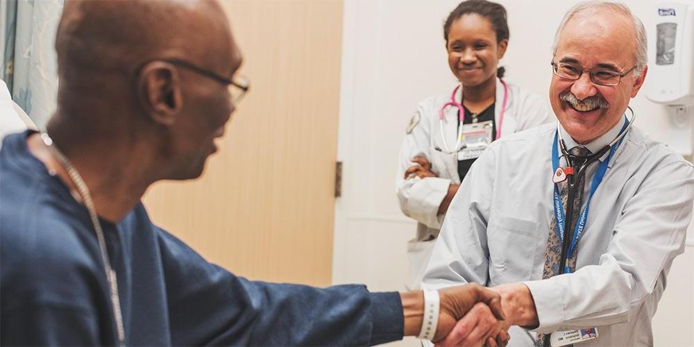 Dr. Graziano, greeting a patient